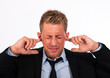 young business man keeping his ears shut