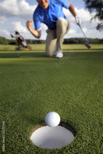 Photo: Ball rolling into the hole Ball rolling into the hole