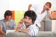 Handsome young man making a call with his friends