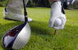 hand placing a tee with golf ball hand placing a tee with golf ball