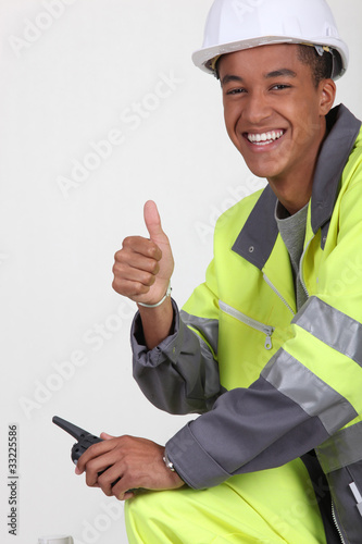 Photo: Construction worker with a walkie talkie Construction worker with a walkie talkie
