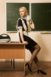 Pretty school girl in a classroom Pretty school girl in a classroom