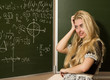 Happy school girl on math classes finding solution Happy school girl on math classes finding solution