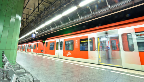 Photo: subway station with a train in Munich, Germany subway station with a train in Munich, Germany
