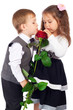 Two little children with red rose
