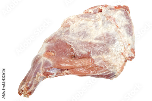 Photo: Closeup of defrosted raw lamb leg isolated on white Closeup of defrosted raw lamb leg isolated on white