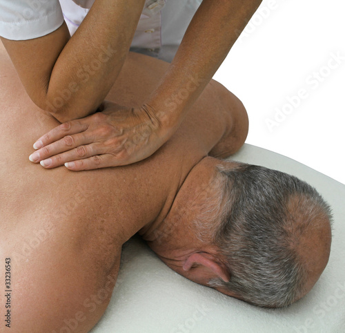 Photo: Therapist applying pressure to patients multifidus Therapist applying pressure to patients multifidus