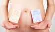Photo: Paper stickers on pregnant woman abdomen Paper stickers on pregnant woman abdomen