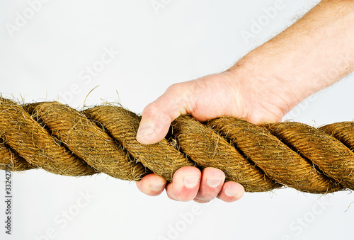 Photo: hand gripping rope hand gripping rope