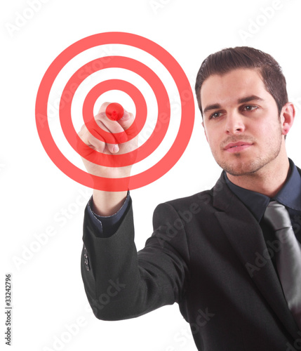 Photo: Businessman pointing a target on the screen using a pen Businessman pointing a target on the screen using a pen