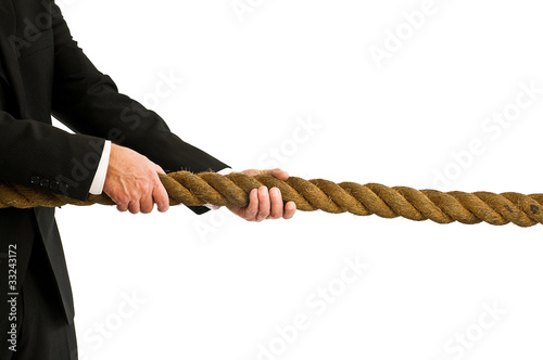 Photo: man pulling rope man pulling rope