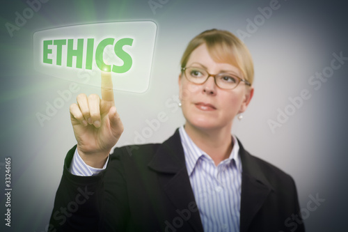 Photo: Woman Pushing Ethics Button on Interactive Touch Screen Woman Pushing Ethics Button on Interactive Touch Screen