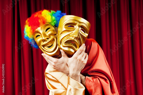 Photo: Actor with maks in a funny theater concept Actor with maks in a funny theater concept