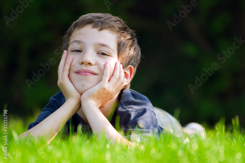 Photo: Cute young child in meadow Cute young child in meadow