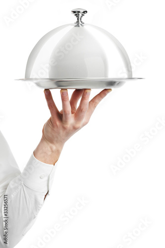 Photo: hand of waiter with cloche lid cover hand of waiter with cloche lid cover