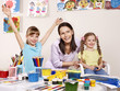 Children painting in preschool.