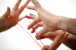 Hand und roter Faden