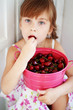 Girl eating cherries