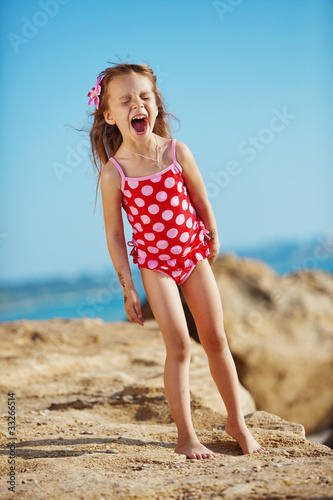 Photo: Child at beach in summer Child at beach in summer