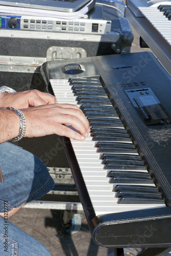 Photo: Detail of keyboardist’s hands during a concert Detail of keyboardist’s hands during a concert