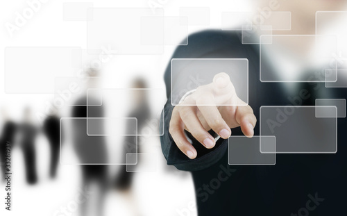 Photo: hand pushing on a touch screen interface hand pushing on a touch screen interface