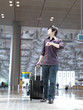 Asian Chinese business traveller at the airport Asian Chinese business traveller at the airport