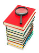 Magnifying glass and books