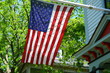 American Flag Outside A House In Small Town USA