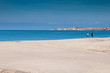 Sardinia, Italy: couple walking on Badesi beach