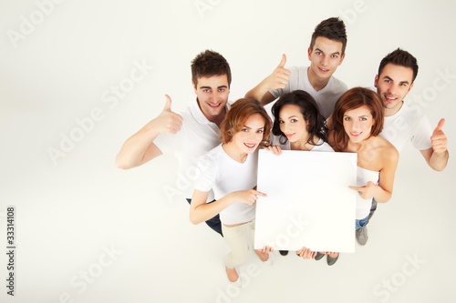 Photo: friends holding blank banner friends holding blank banner