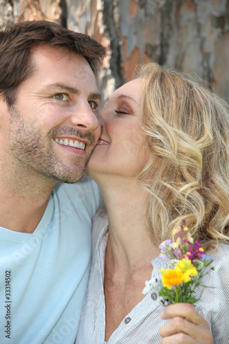 Photo: Romantic couple with wild flowers Romantic couple with wild flowers