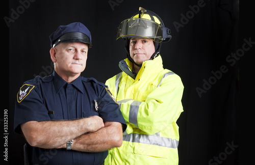 Photo: Fireman and Policeman with Copyspace Fireman and Policeman with Copyspace