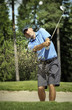 golfer shooting a golf ball
