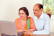 Photo: Mature indian couple on home computer Mature indian couple on home computer