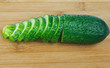 Sliced fresh cucumber on chopping board Sliced fresh cucumber on chopping board