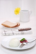 mozzarella with cranberry sauce, in background bread and flower