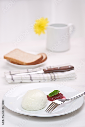 Photo: mozzarella with cranberry sauce, in background bread and flower mozzarella with cranberry sauce, in background bread and flower
