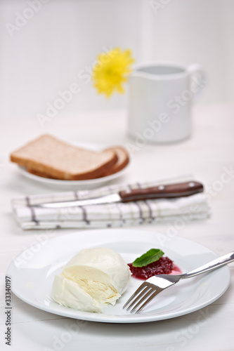 Photo: mozzarella with cranberry sauce, in background bread and flower mozzarella with cranberry sauce, in background bread and flower