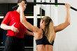 Woman with Personal Trainer in gym
