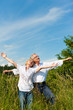 Happy senior couple having fun outdoors in summer