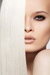 Portrait of beautiful model with straight shiny long blond hair