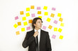 young businessman with postit reminder notes on the background young businessman with postit reminder notes on the background