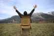 successful man sitting in armchair in the nature