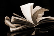 Book with motion blur on black background Book with motion blur on black background