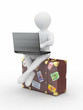 Man with laptop on the luggage