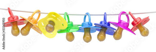 Illustration: Row of babies dummies on rope. Row of babies dummies on rope.
