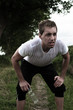 Foto: young sportsman beeing exhausted after a run young sportsman beeing exhausted after a run
