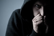 Foto: angry man wearing a hood angry man wearing a hood