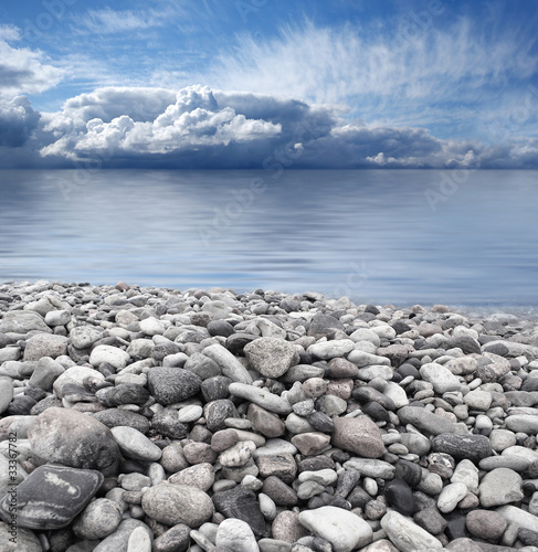 Photo: Beautiful view of a grey rocky mediterranean shore Beautiful view of a grey rocky mediterranean shore