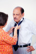 Photo: Senior male executive dressing up routine Senior male executive dressing up routine